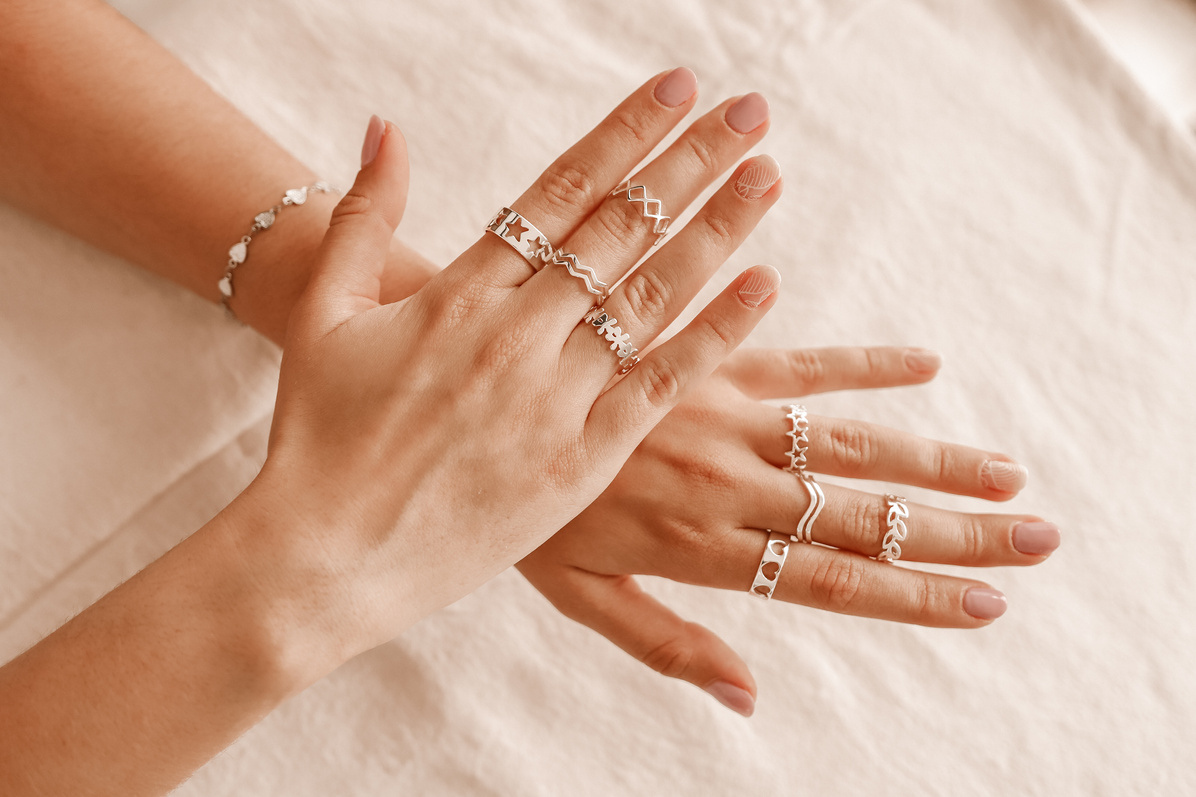 Hand with Assorted Silver Rings